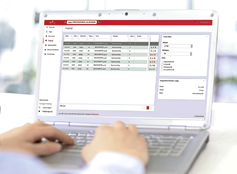 Person Typing on a modern laptop in an office